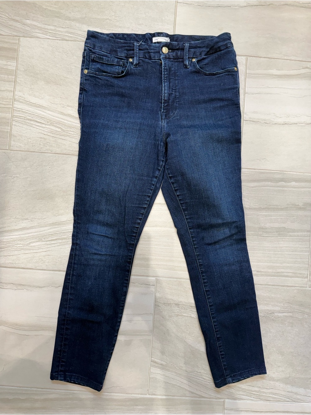 Good American navy blue high-rise jeans with gold button